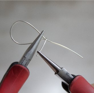Bending the shorter wire with your needle nose pliers
