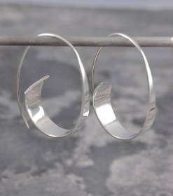 flared ribbon sterling silver hoop earrings by otis jaxon silver jewellery | notonthehighstreet.com £45