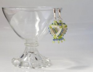 Pair of Beaded Earrings Hanging from a Glass Bowl